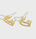 18k gold love knot sculptural stud earrings - Kaiya London