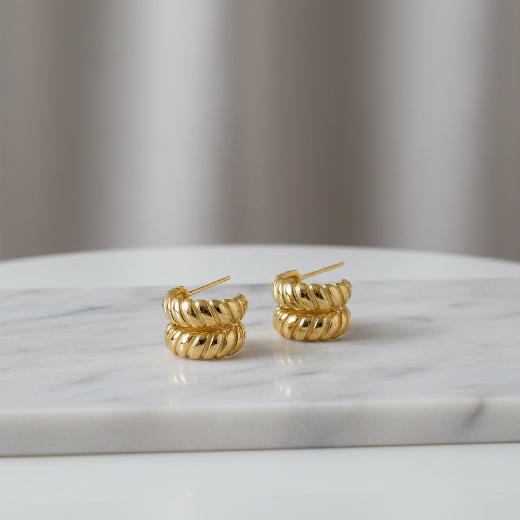 mini huggie hoop earrings flat lay waterproof tarnish free PVD
