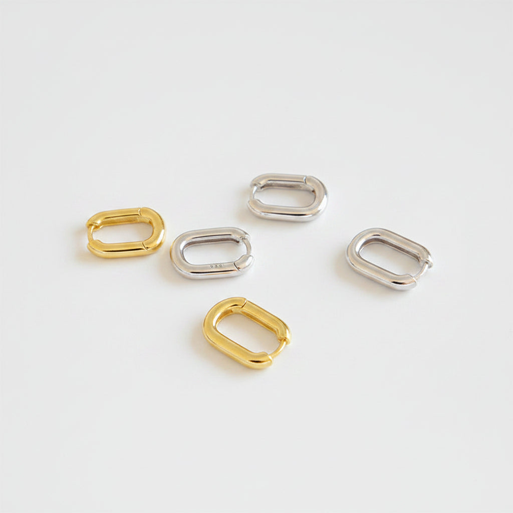 silver oval stud earrings close up organic shape