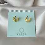 triple dot climber earrings close up three gold dots