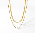 18k gold herringbone choker necklace layering set flat lay - Kaiya London