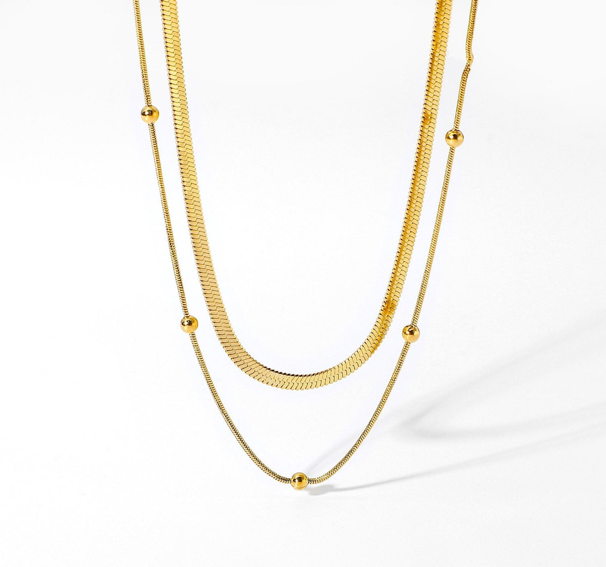 18k gold herringbone choker necklace layering set flat lay - Kaiya London