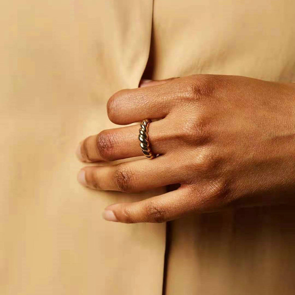 gold slim sculptural ring stacking with other rings