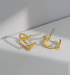 gold love knot studs styling shot waterproof PVD