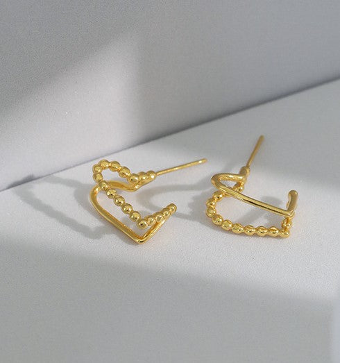 gold love knot studs styling shot waterproof PVD