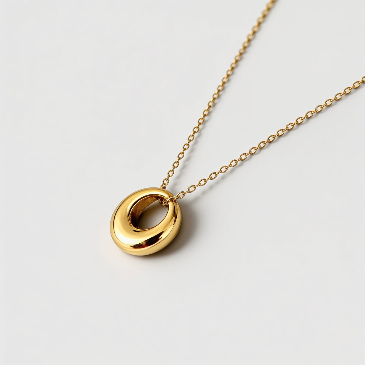 18k gold circle pendant necklace worn on model - Kaiya London