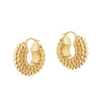 large gold textured hoop earrings on model