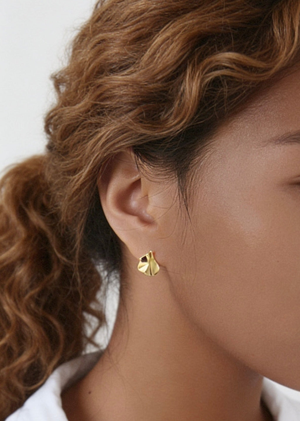 18K gold hammered leaf stud earrings close up waterproof jewellery