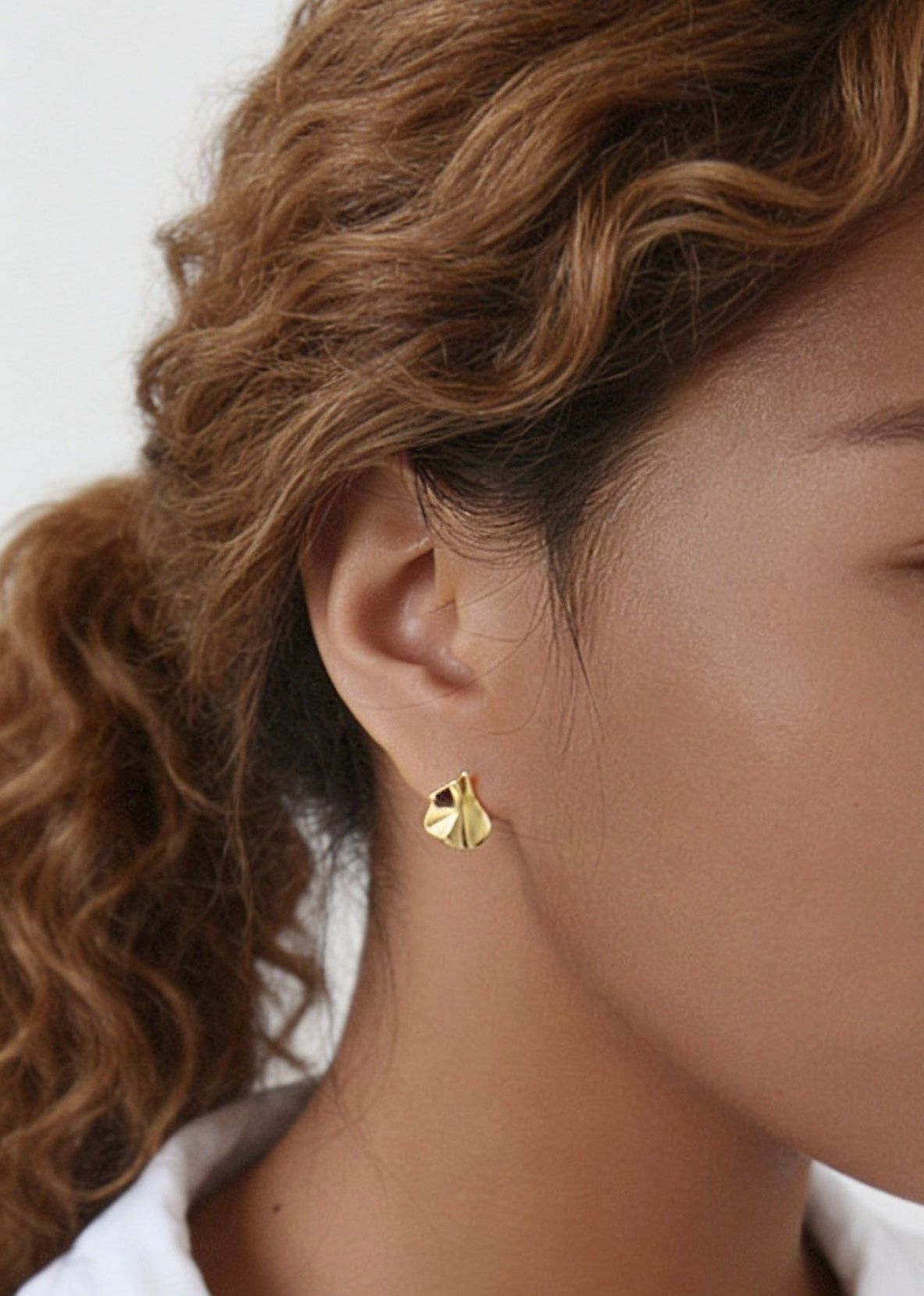 18K gold hammered leaf stud earrings close up waterproof jewellery